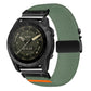 Green diagonal-weave stretch nylon watch band with black buckle and orange accent, shown on a watch