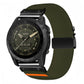 Olive green diagonal-weave stretch nylon watch band with black buckle and orange accent, shown on a watch