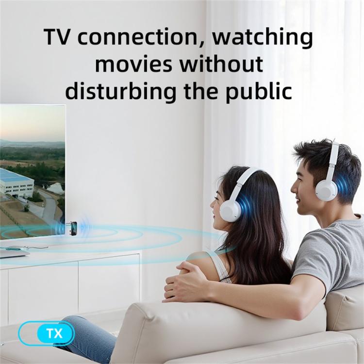 Wireless Bluetooth audio adapter used with over-ear headphones on couch