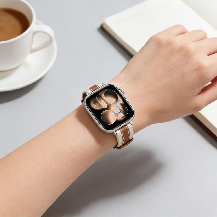 Apple Watch with a tan and cream leather band featuring contrast stitching