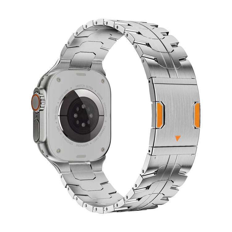 Silver metal watch band attached to a smartwatch, with orange-accented magnetic clasp.