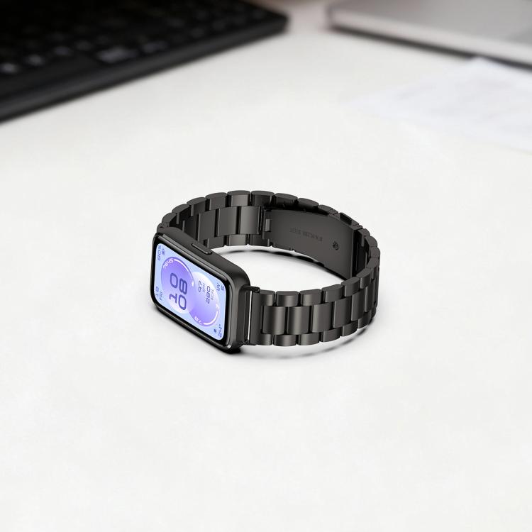 Black stainless steel three-link watch band fitted to a smartwatch, shown with the screen on.