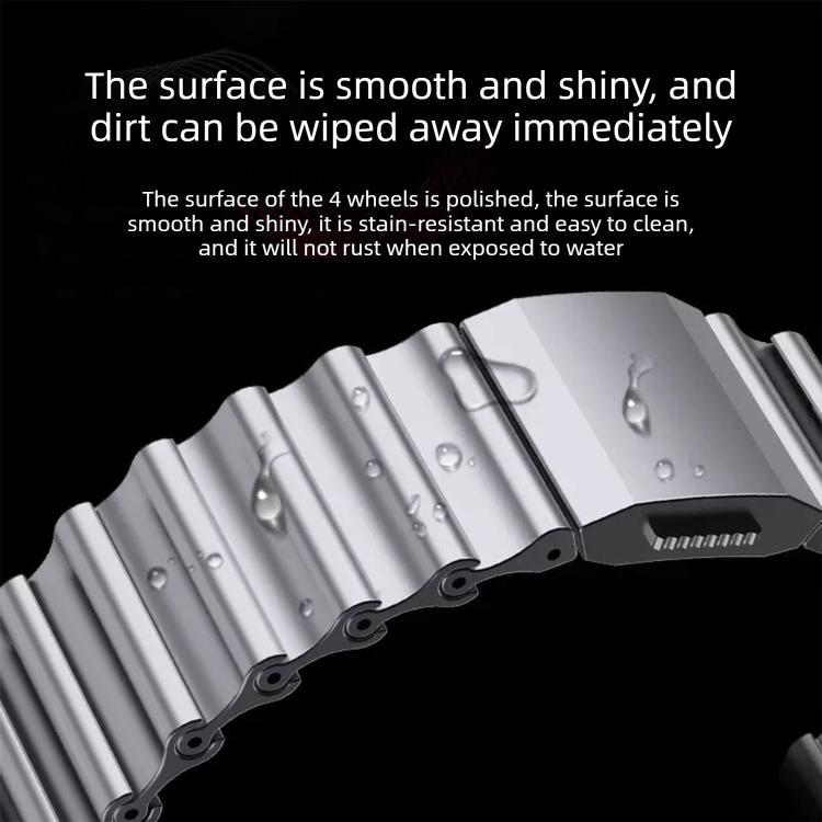 Close-up of polished silver wave-textured watch band links and clasp
