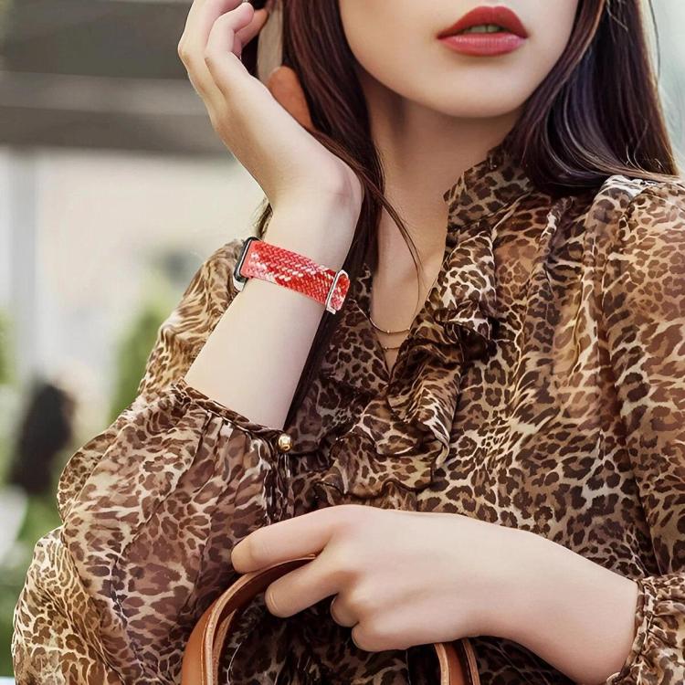 Red woven watch band with slide buckle, worn on wrist