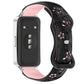 Black and light pink floral cutout watch band with reverse buckle, attached to a smartwatch