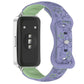 Purple and green floral watch band with a reverse buckle, shown on a watch