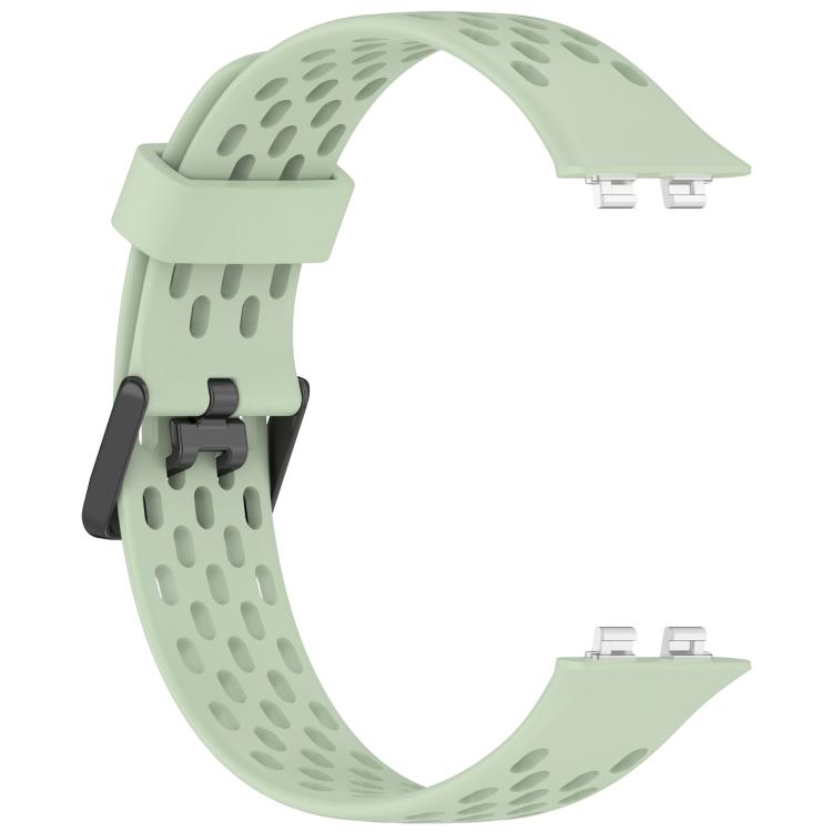 Light green perforated silicone watch band showing its buckle and connector ends