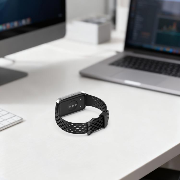 Black perforated silicone watch band attached to a rectangular smartwatch, clasp closed.