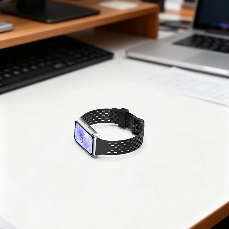 Black perforated silicone watch band attached to a rectangular smartwatch, viewed from the side.