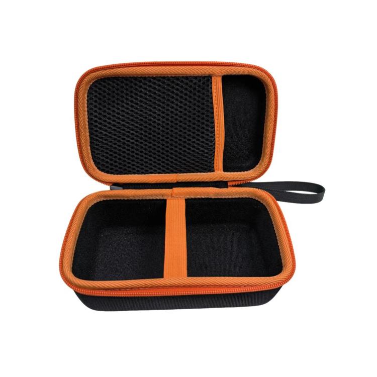 Opened hard multimeter case with foam dividers and orange trim