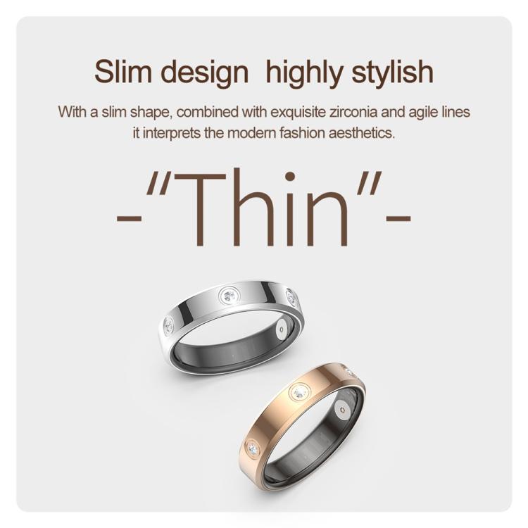 Slim silver and gold smart rings with clear stones, shown at an angle