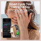 Smart health ring shown beside a phone displaying menstrual cycle tracking