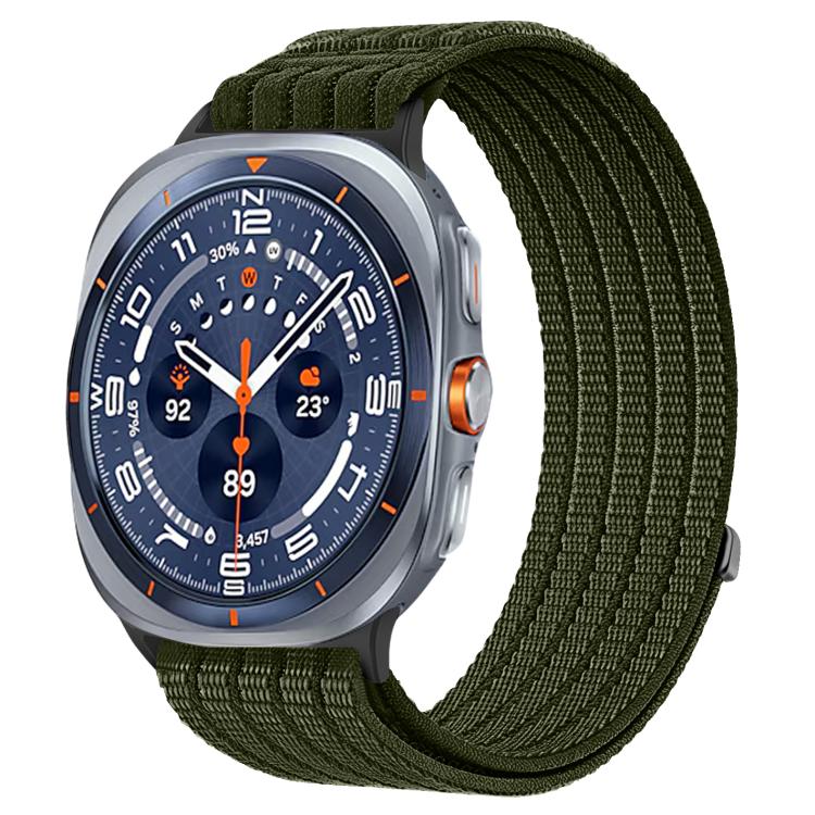 Galaxy Watch woven nylon band in dark green, shown on a silver smartwatch