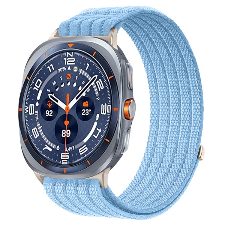 Galaxy Watch woven nylon band in light blue, shown on a silver smartwatch