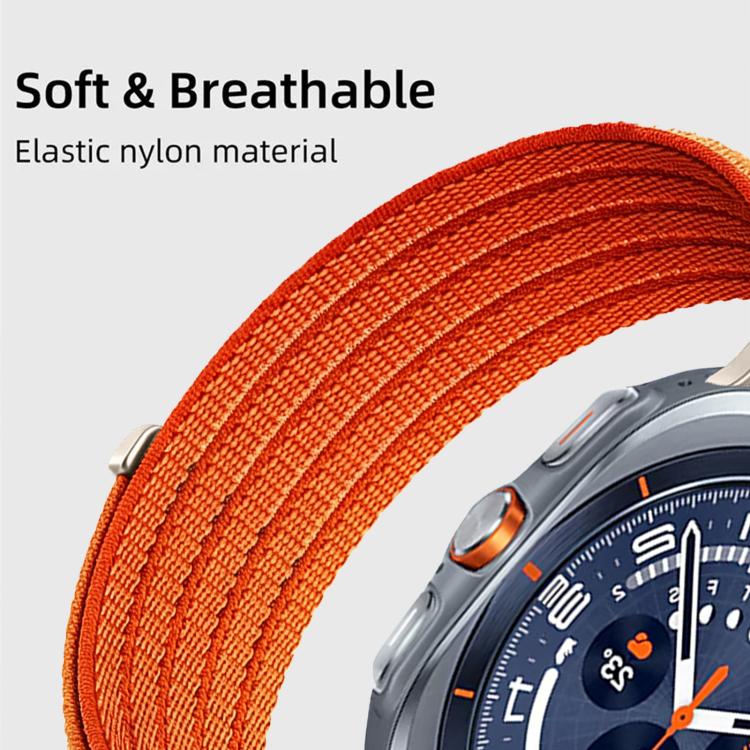 Close-up of the orange woven nylon watch band and metal connector