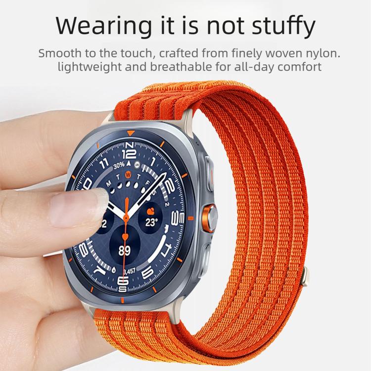Orange woven nylon watch band on a smartwatch, shown worn on a wrist