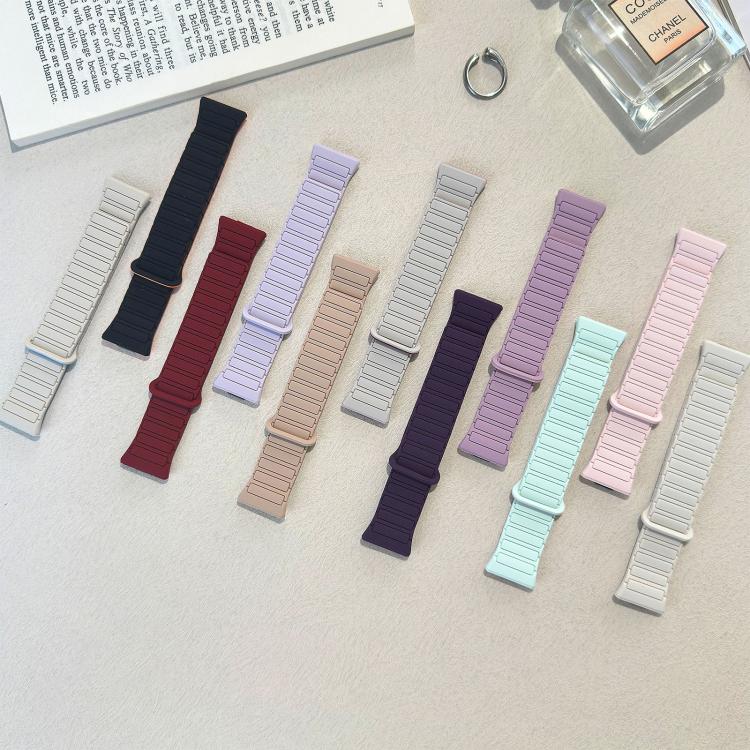 Assorted silicone watch bands in multiple colors, laid out individually