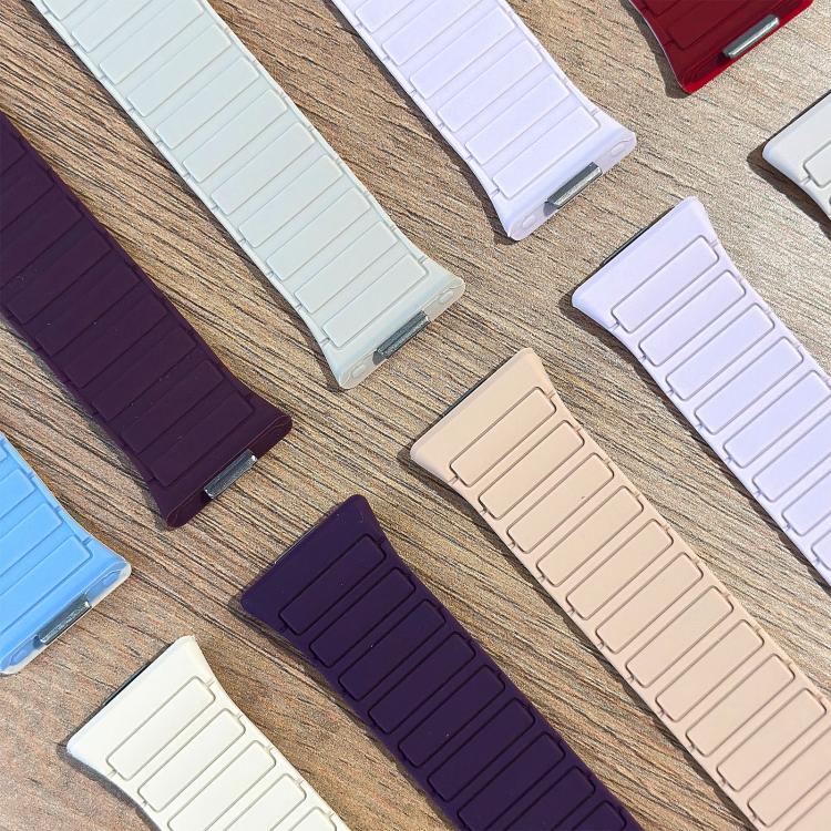 Close-up of multicolor silicone watch band segments with ridged links