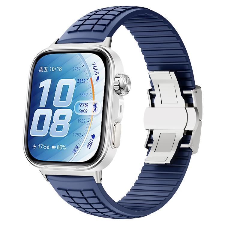 Dark blue silicone watch band with knurled texture and folding buckle on a smartwatch