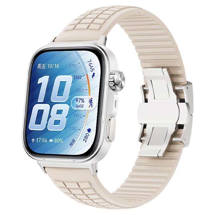 Starlight silicone watch band with knurled texture and folding buckle on a smartwatch