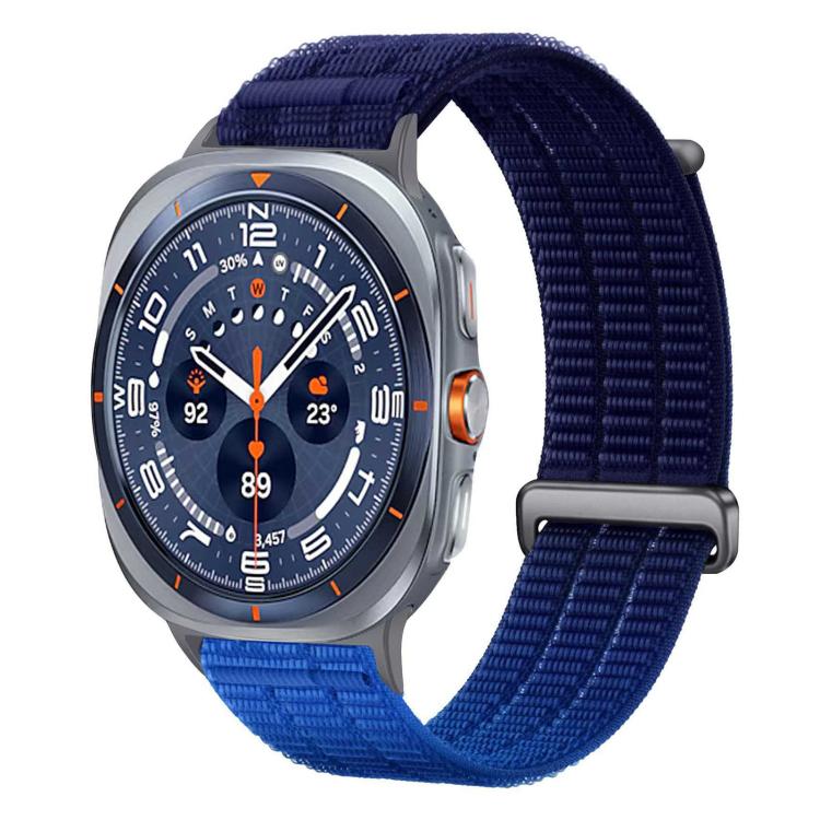 Nylon watch band with dark navy and blue sections and a metal loop.