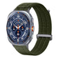 Dark green nylon watch band with a metal loop and textured weave.