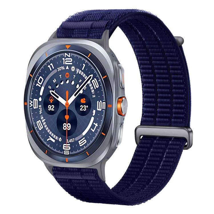 Deep blue nylon watch band with a metal loop and textured weave.