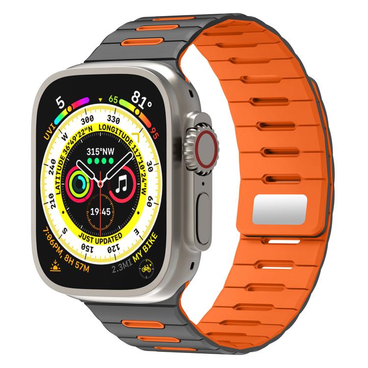 Two-tone silicone watch band in gray and orange on a smartwatch