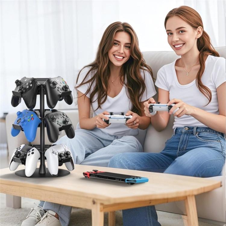 Three-tier rotating game controller stand with angled holders beside a seating setup