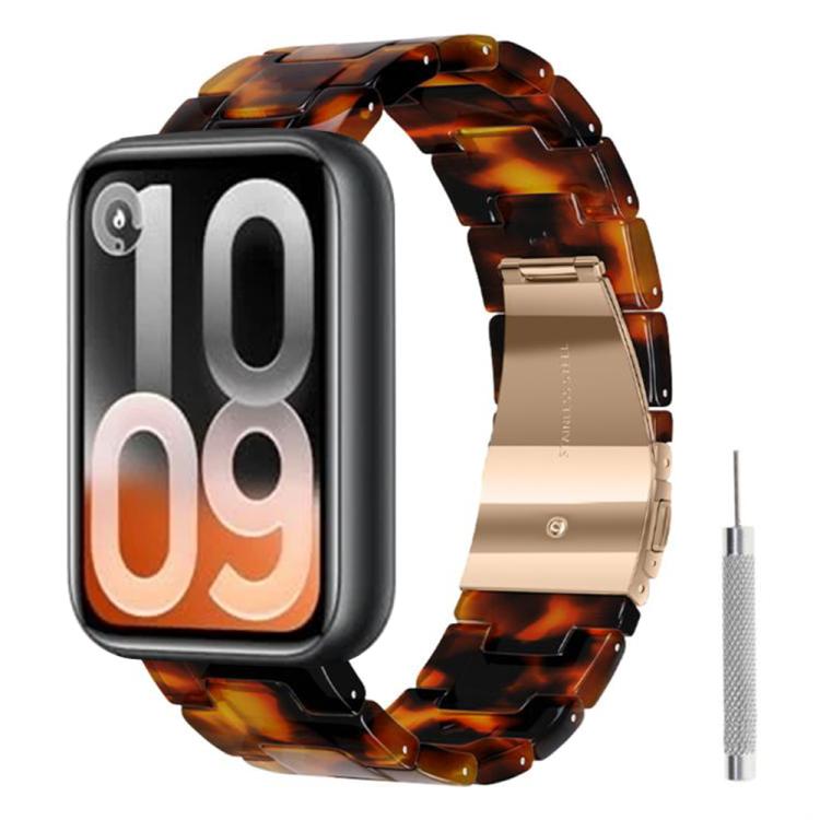 Tortoiseshell resin watch band with rose gold clasp and adjustment tool