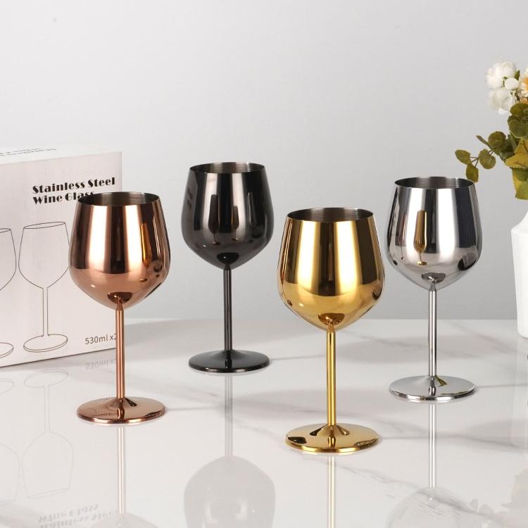 Assorted metal stemmed wine glasses in copper, black, gold, and silver finishes