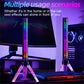 RGB pickup lamp on clear tripod beside a monitor and keyboard, vertical rainbow LED bar