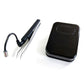 Black wireless foot pedal with attached cable and UV eyelash curing lamp