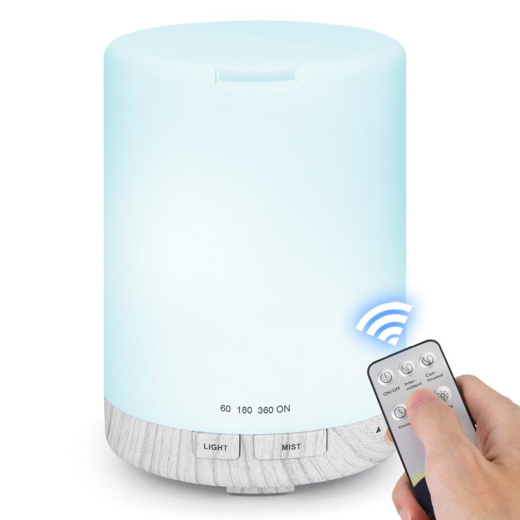 Ultrasonic essential oil diffuser with blue LED glow and light gray wood-grain base, with remote