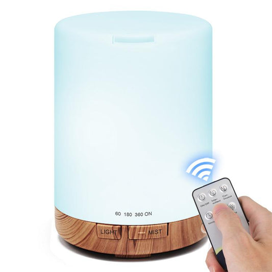 Ultrasonic essential oil diffuser with blue LED glow and light wood-grain base, with remote