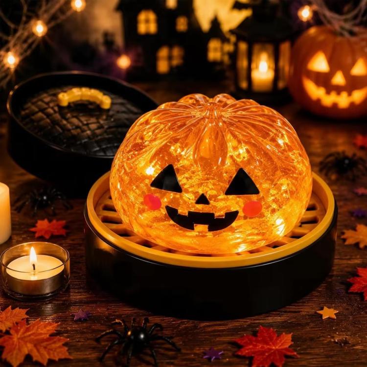 Orange jack-o'-lantern dumpling squishy stress relief toy with carved smile