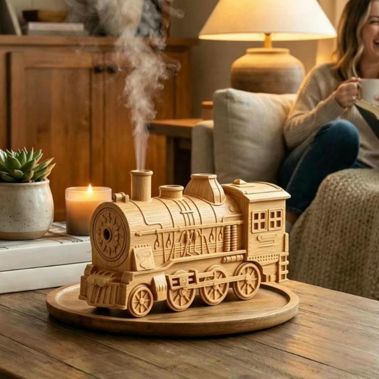 Wood-colored train humidifier releasing mist beside a person on a sofa