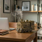 Antique bronze train-shaped desktop humidifier releasing mist on a wooden table