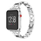 Smartwatch with silver X-shaped metal link strap and red side button detail