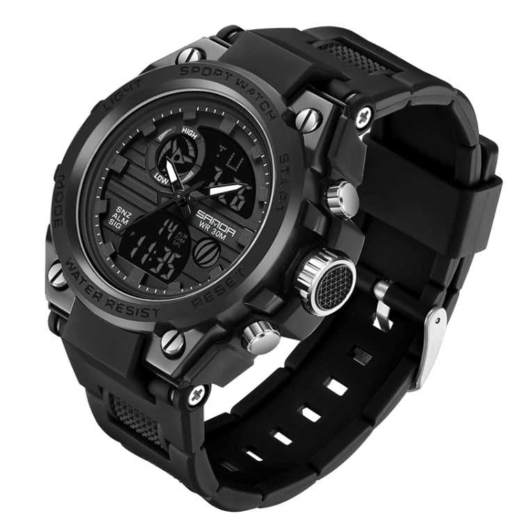 All-black sport wristwatch with silver buttons, black silicone strap, analog-digital face.