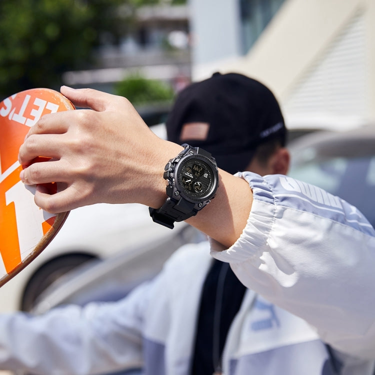Black digital sports watch on wrist with round dark dial and sporty strap