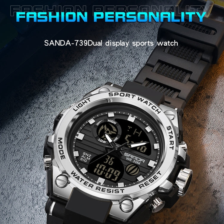 Sport wristwatch with silver case and black silicone strap, digital readout on dial face.