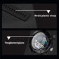 Black digital sports watch close-up, textured strap, round bezel with visible side buttons