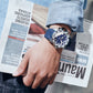 Men’s quartz sports watch on wrist with blue dial and blue silicone band