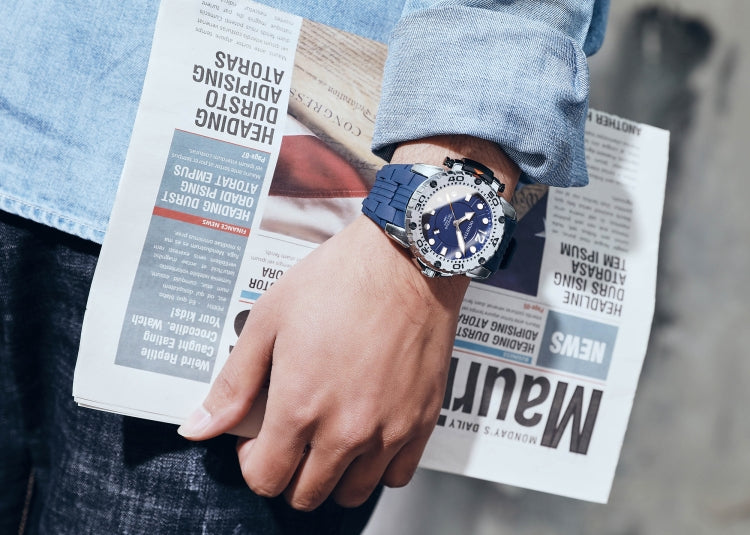 Men’s quartz sports watch on wrist with blue dial and blue silicone band