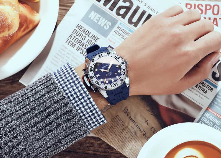 Men’s quartz sports watch on wrist, blue dial and blue silicone band close-up