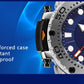 Rugged stainless steel watch case with blue silicone strap, angled side view.