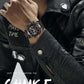 Men's quartz chronograph watch with black dial and leather strap on wrist