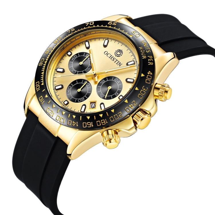 Gold-tone chronograph watch angled view with black silicone strap and side crown buttons