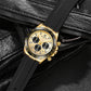 Gold-tone quartz chronograph watch on black strap, white dial with three subdials